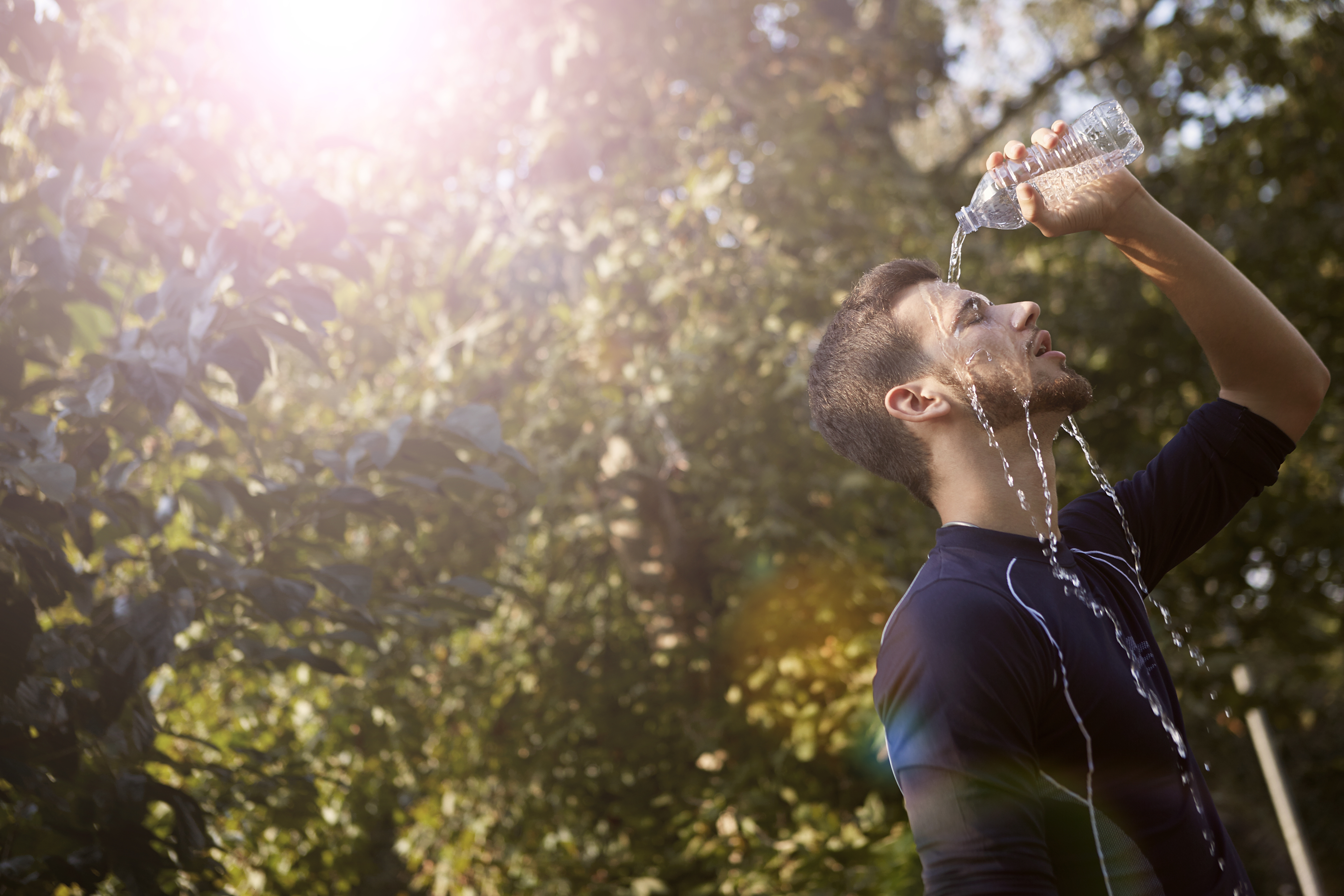 Canva_-_Man_in_Blue_Crew_Neck_T-shirt_While_Pouring_Water_on_His_Face.jpg